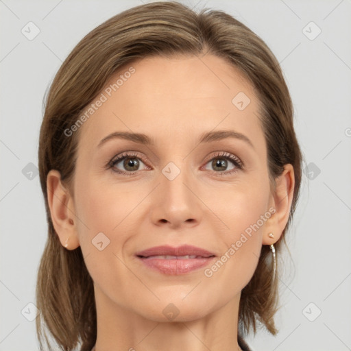 Joyful white adult female with medium  brown hair and brown eyes