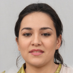 Joyful white young-adult female with medium  brown hair and brown eyes