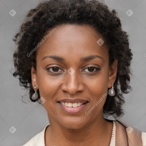 Joyful black young-adult female with long  brown hair and brown eyes