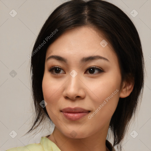 Joyful asian young-adult female with medium  brown hair and brown eyes