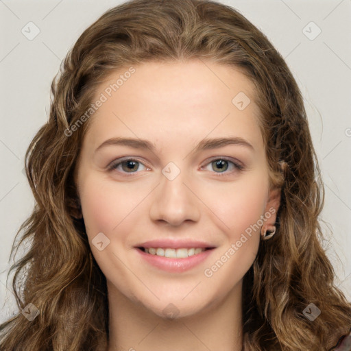 Joyful white young-adult female with long  brown hair and green eyes
