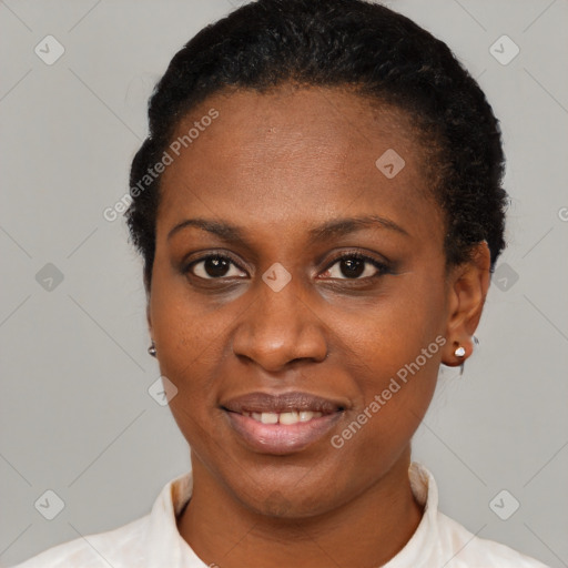 Joyful black young-adult female with short  black hair and brown eyes