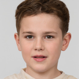 Joyful white child male with short  brown hair and brown eyes