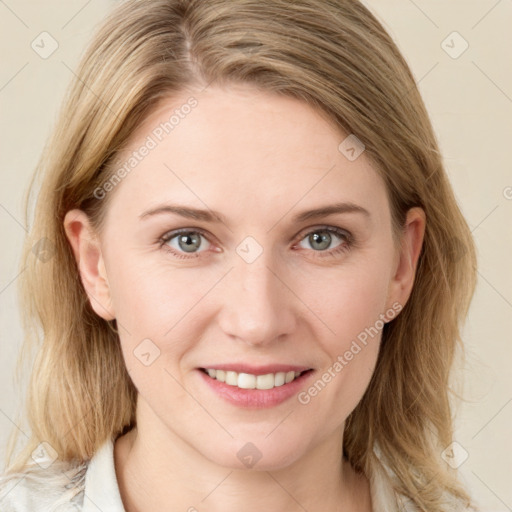 Joyful white young-adult female with medium  brown hair and blue eyes