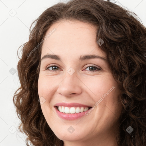 Joyful white young-adult female with long  brown hair and green eyes