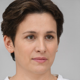 Joyful white adult female with short  brown hair and brown eyes