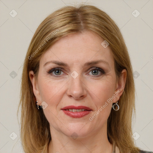 Joyful white adult female with medium  brown hair and grey eyes