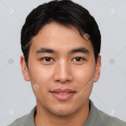 Joyful asian young-adult male with short  brown hair and brown eyes