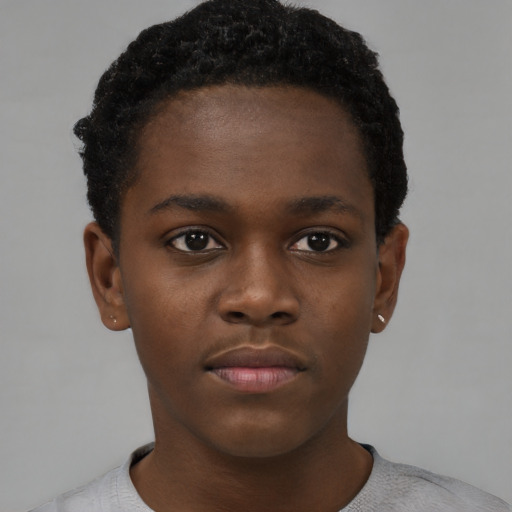 Neutral black child male with short  black hair and brown eyes