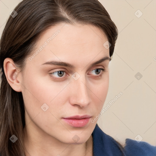 Neutral white young-adult female with medium  brown hair and brown eyes