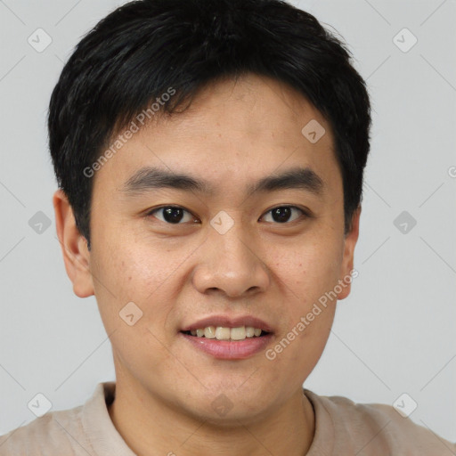 Joyful asian young-adult male with short  black hair and brown eyes