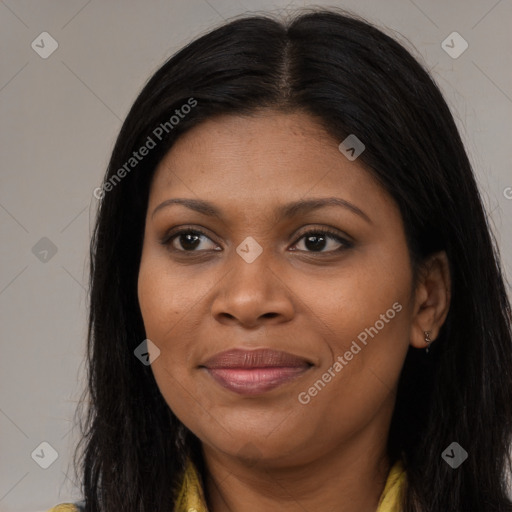 Joyful black young-adult female with long  brown hair and brown eyes