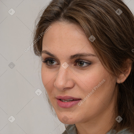 Joyful white adult female with medium  brown hair and grey eyes