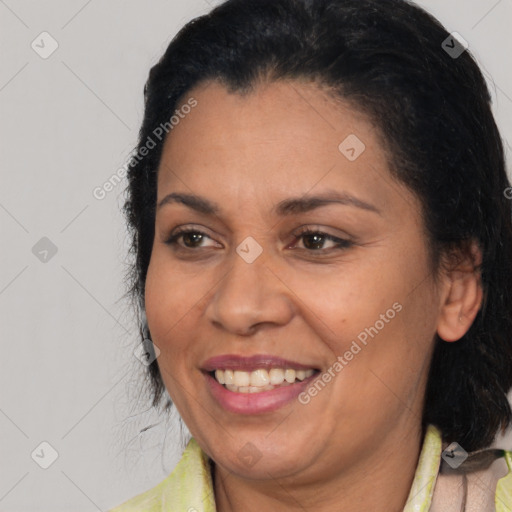 Joyful latino young-adult female with medium  brown hair and brown eyes