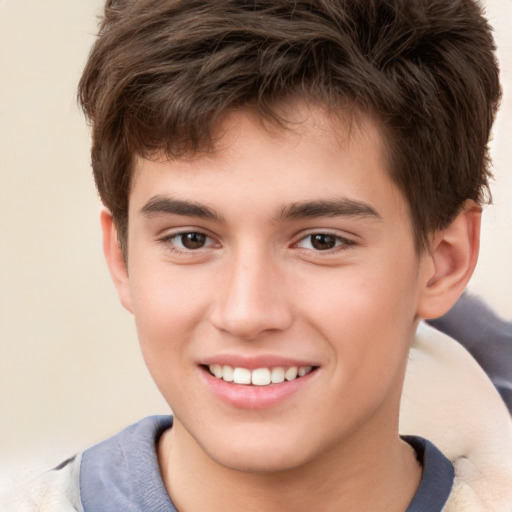 Joyful white child male with short  brown hair and brown eyes