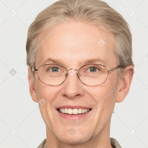 Joyful white adult male with short  brown hair and blue eyes