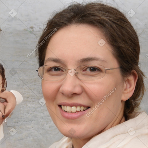 Joyful white adult female with medium  brown hair and brown eyes