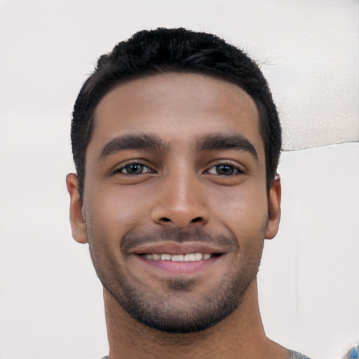 Joyful white young-adult male with short  black hair and brown eyes