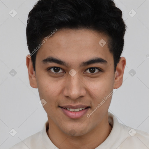 Joyful latino young-adult male with short  brown hair and brown eyes