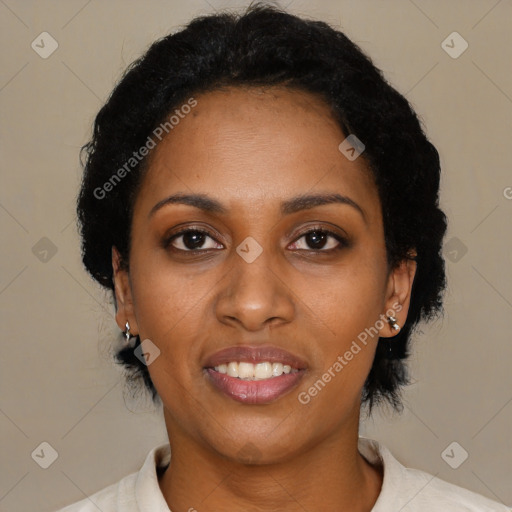 Joyful black young-adult female with short  black hair and brown eyes