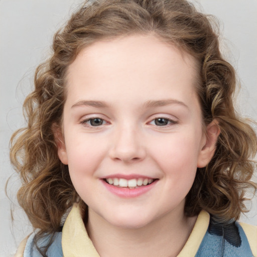 Joyful white child female with medium  brown hair and blue eyes