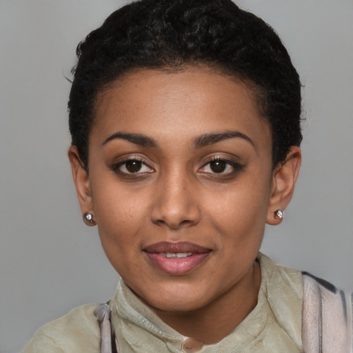 Joyful latino young-adult female with short  black hair and brown eyes