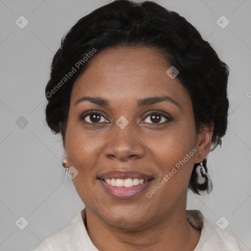 Joyful black adult female with short  brown hair and brown eyes