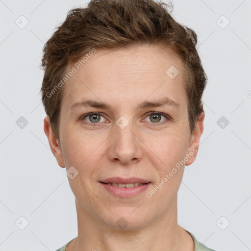 Joyful white young-adult female with short  brown hair and grey eyes