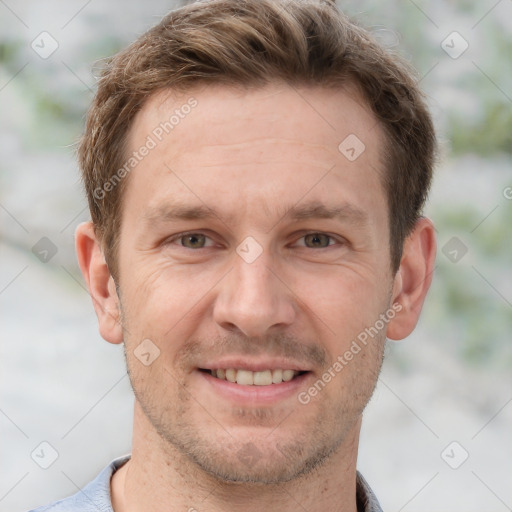 Joyful white adult male with short  brown hair and grey eyes