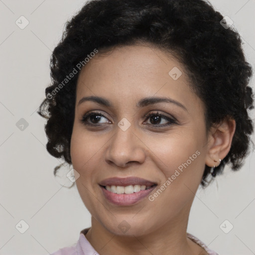 Joyful black young-adult female with medium  brown hair and brown eyes