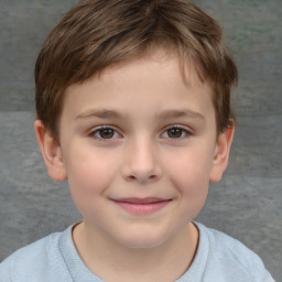 Joyful white child male with short  brown hair and brown eyes
