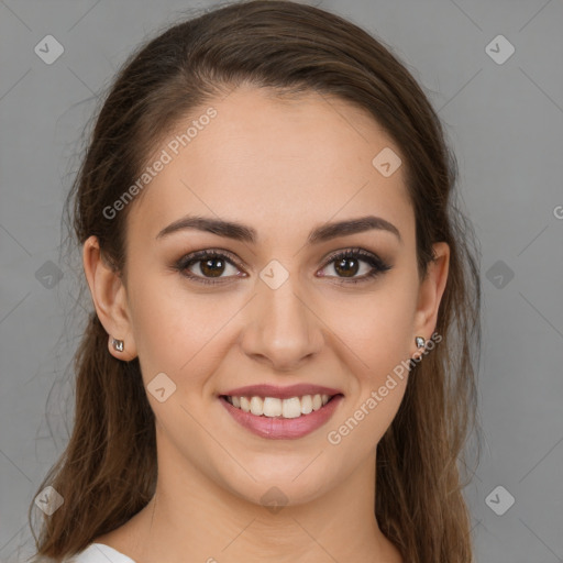 Joyful white young-adult female with long  brown hair and brown eyes