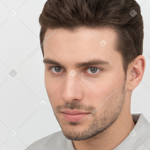 Neutral white young-adult male with short  brown hair and brown eyes