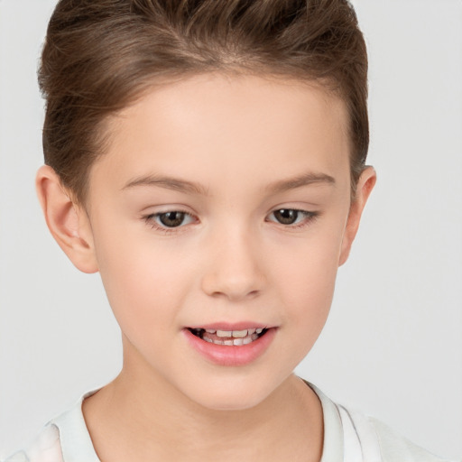 Joyful white child female with short  brown hair and brown eyes