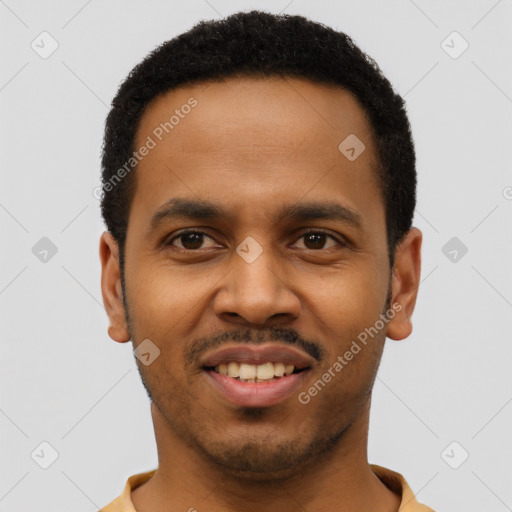 Joyful black young-adult male with short  black hair and brown eyes