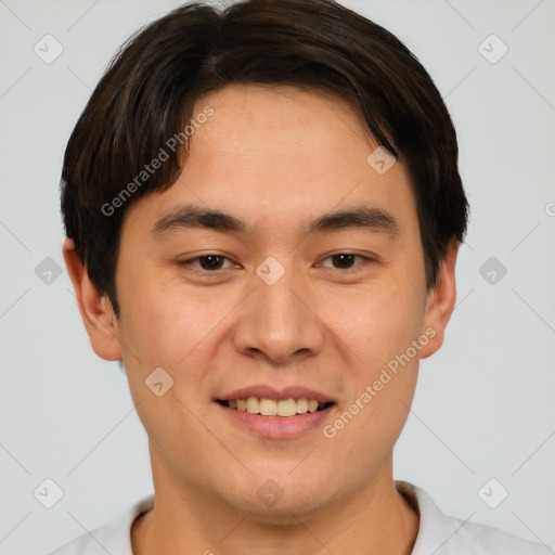 Joyful asian young-adult male with short  brown hair and brown eyes