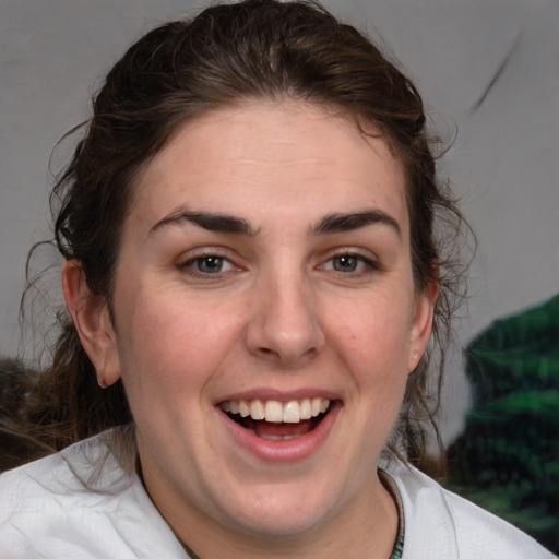 Joyful white young-adult female with medium  brown hair and blue eyes