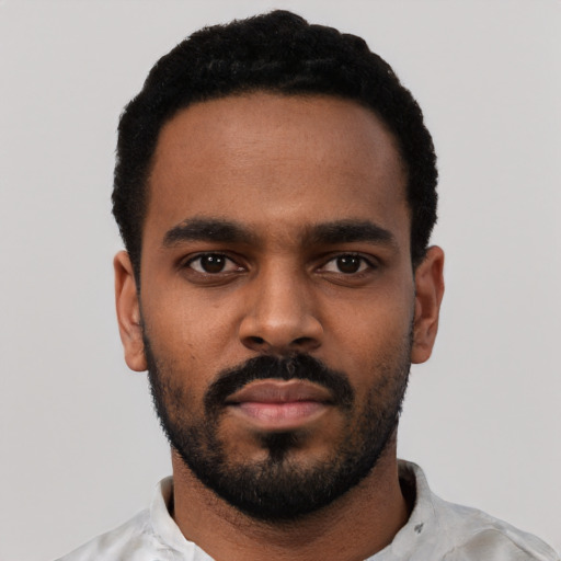 Neutral black young-adult male with short  black hair and brown eyes