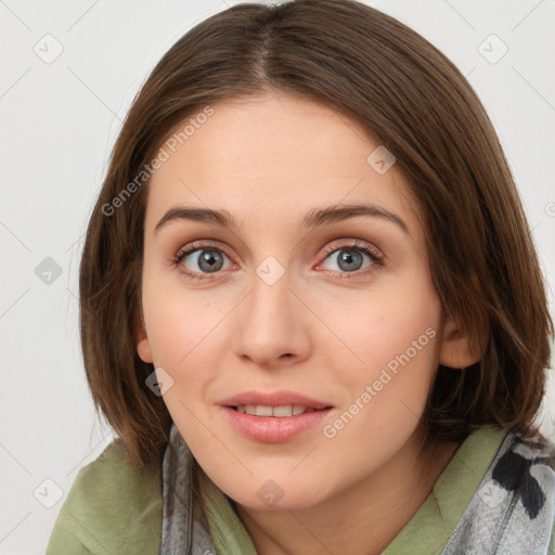 Joyful white young-adult female with medium  brown hair and blue eyes