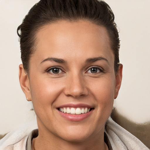 Joyful white young-adult female with short  brown hair and brown eyes