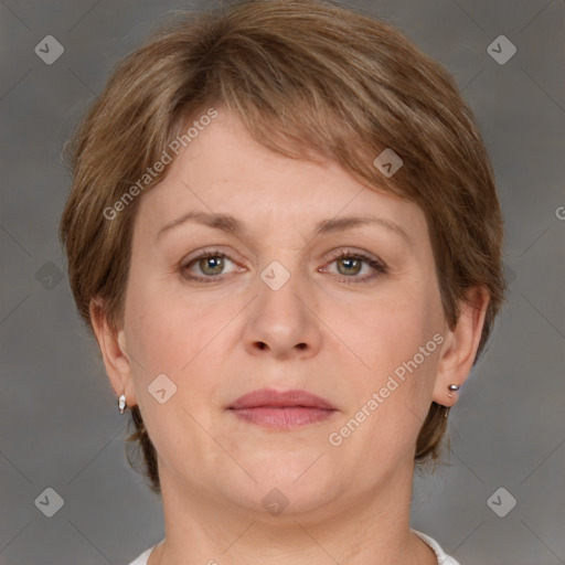 Joyful white adult female with medium  brown hair and grey eyes