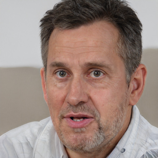 Joyful white middle-aged male with short  brown hair and brown eyes