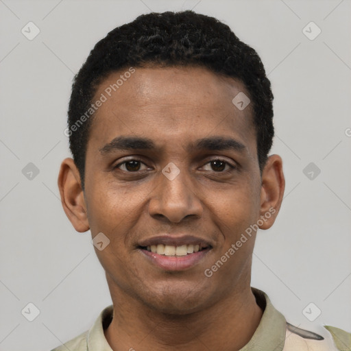 Joyful black young-adult male with short  black hair and brown eyes