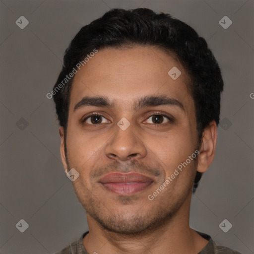 Joyful latino young-adult male with short  black hair and brown eyes