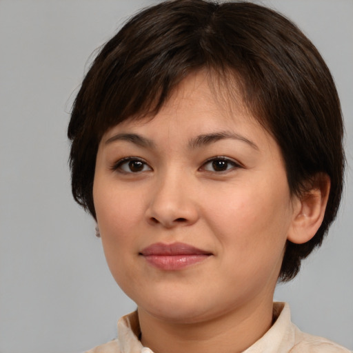Joyful white young-adult female with medium  brown hair and brown eyes