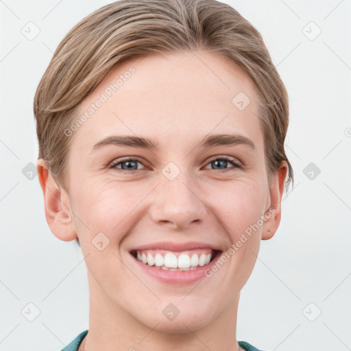 Joyful white young-adult female with short  brown hair and grey eyes