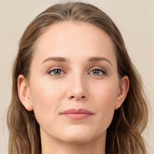 Joyful white young-adult female with long  brown hair and grey eyes