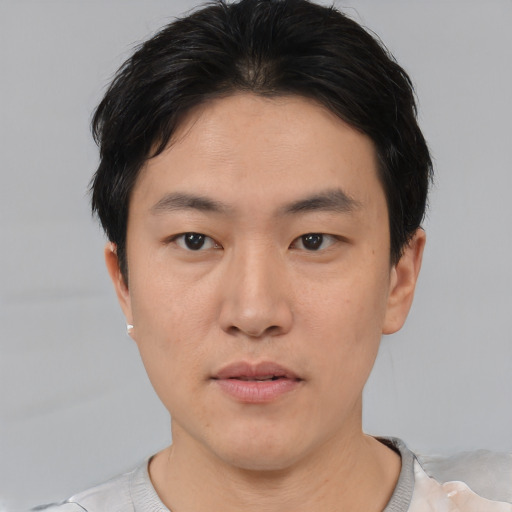 Neutral asian young-adult male with short  black hair and brown eyes