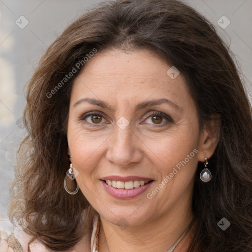 Joyful white adult female with long  brown hair and brown eyes