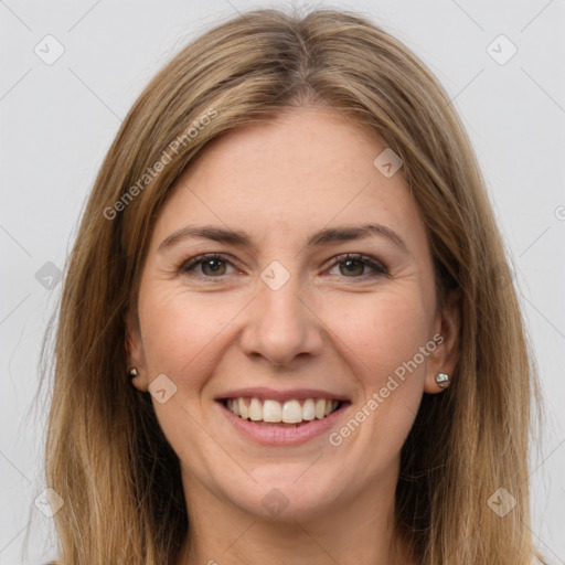 Joyful white young-adult female with long  brown hair and brown eyes